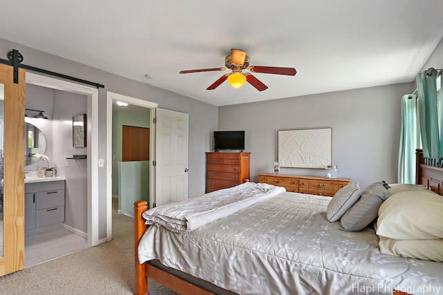 2184 N Masters Ln, Lake Villa, IL 60046 - bedroom featuring light colored carpet, a barn door, ceiling fan, and connected bathroom