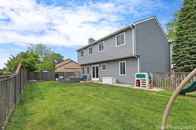2184 N Masters Ln, Lake Villa, IL 60046 - rear view of property with an outdoor hangout area, a chimney, and a fenced backyard