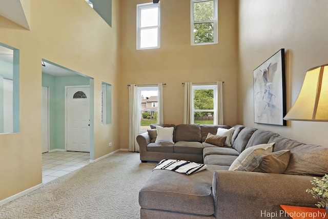 2184 N Masters Ln, Lake Villa, IL 60046 - carpeted living room featuring a towering ceiling and tile patterned flooring
