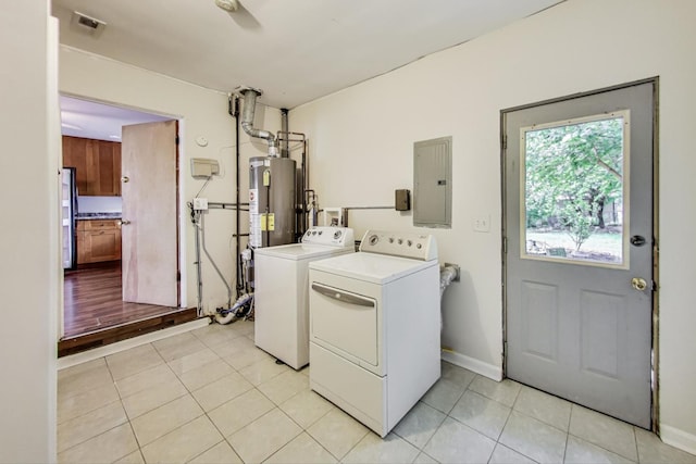 2030 Cedar Ave, Hanover Park, IL 60133 - washroom featuring electric panel, separate washer and dryer, light tile patterned flooring, and water heater