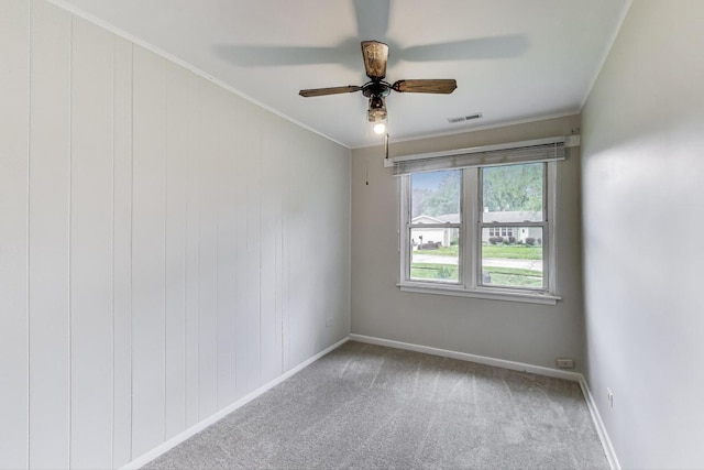 2030 Cedar Ave, Hanover Park, IL 60133 - carpeted spare room featuring a ceiling fan and ornamental molding