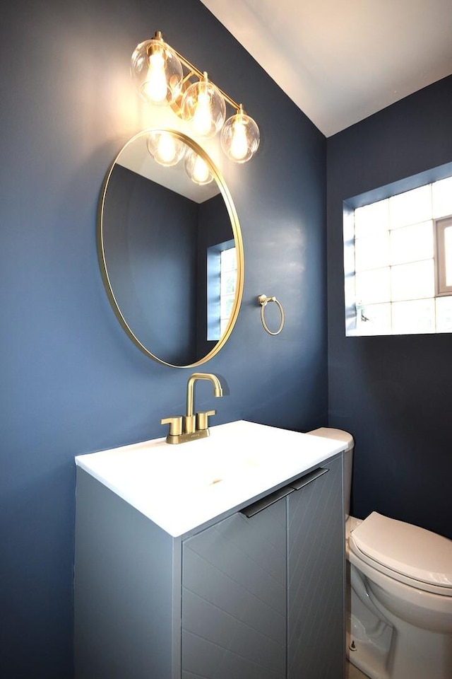 8812 S Euclid Ave, Chicago, IL 60617 - half bathroom featuring vanity and toilet