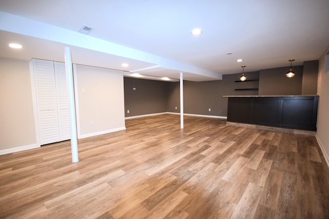 8812 S Euclid Ave, Chicago, IL 60617 - finished basement with light wood finished floors, recessed lighting, and bar area