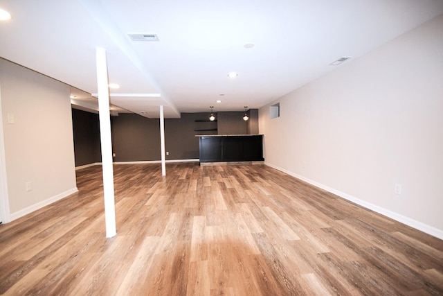 8812 S Euclid Ave, Chicago, IL 60617 - finished basement featuring light wood finished floors, recessed lighting, and bar