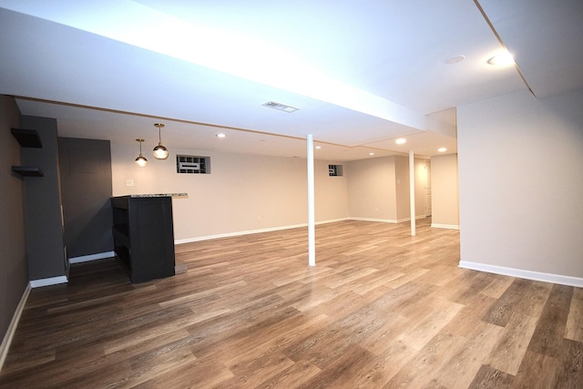 8812 S Euclid Ave, Chicago, IL 60617 - finished below grade area with recessed lighting, wood finished floors, and bar area