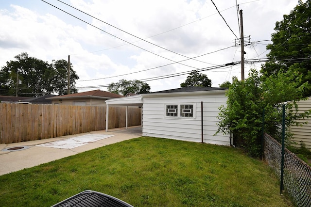 8812 S Euclid Ave, Chicago, IL 60617 - fenced backyard featuring a carport and an outdoor structure