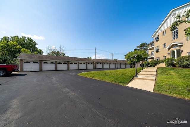 1258 Chalet Rd Unit 104, Naperville, IL 60563 - view of street featuring community garages and street lighting