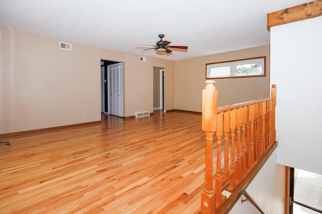 2214 E Lincoln St Unit 14, Bloomington, IL 61701 - spare room with light wood finished floors and ceiling fan