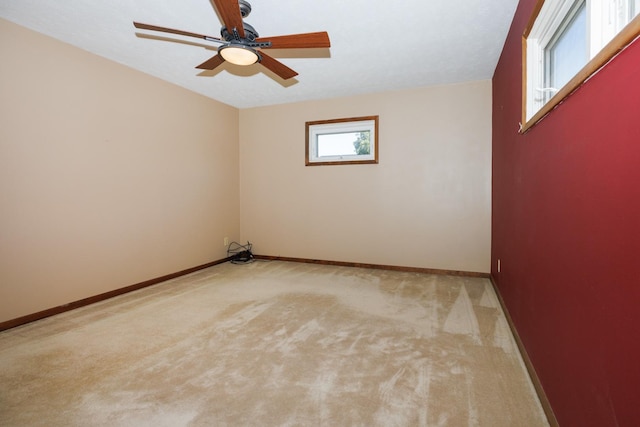 2214 E Lincoln St Unit 14, Bloomington, IL 61701 - spare room with light carpet and a ceiling fan