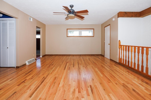2214 E Lincoln St Unit 14, Bloomington, IL 61701 - spare room with light wood finished floors and a ceiling fan