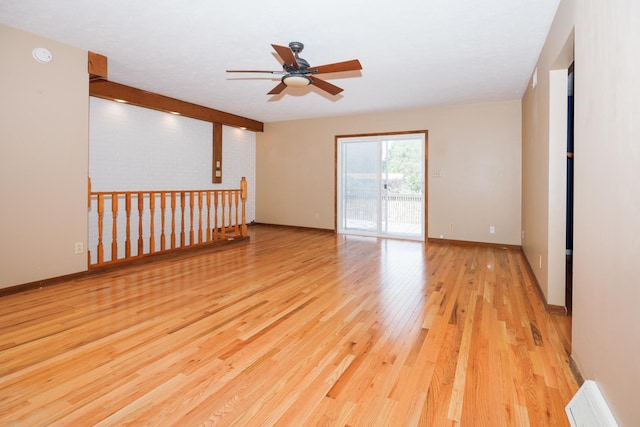2214 E Lincoln St Unit 14, Bloomington, IL 61701 - empty room featuring a ceiling fan, light wood finished floors, and a smoke detector