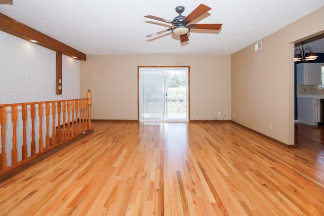 2214 E Lincoln St Unit 14, Bloomington, IL 61701 - unfurnished room featuring light wood finished floors and a ceiling fan