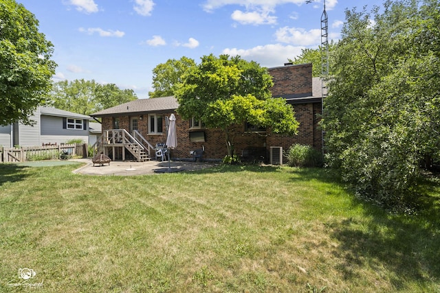 509 Apollo Dr, Joliet, IL 60435 - rear view of house featuring brick siding and a patio area