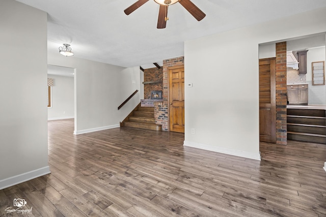 509 Apollo Dr, Joliet, IL 60435 - unfurnished living room featuring stairway, ceiling fan, and wood finished floors