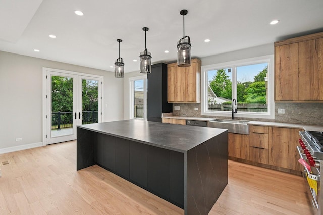 2700 Fontana Dr, Glenview, IL 60025 - kitchen with modern cabinets, a kitchen island, recessed lighting, double oven range, and decorative backsplash