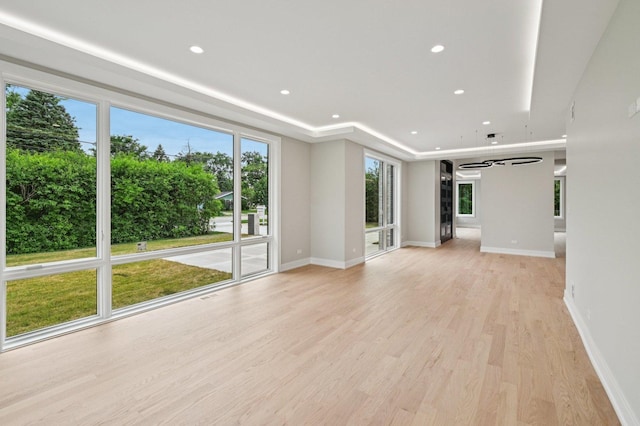 2700 Fontana Dr, Glenview, IL 60025 - unfurnished living room with light wood-style floors and recessed lighting