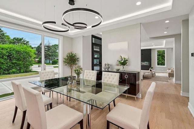 2700 Fontana Dr, Glenview, IL 60025 - dining space with plenty of natural light, a chandelier, light wood-type flooring, recessed lighting, and a tray ceiling
