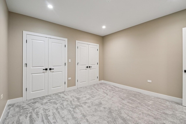 2700 Fontana Dr, Glenview, IL 60025 - unfurnished bedroom featuring two closets, carpet floors, and recessed lighting