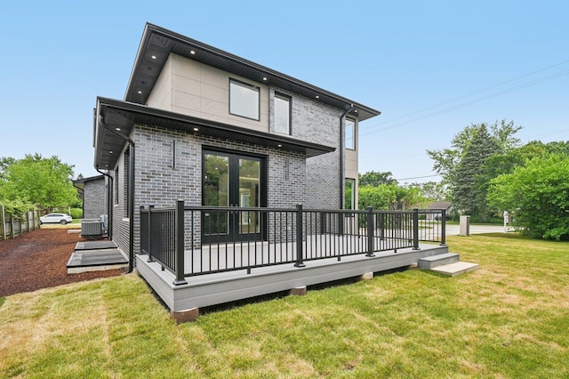 2700 Fontana Dr, Glenview, IL 60025 - back of property featuring a wooden deck, a lawn, and brick siding