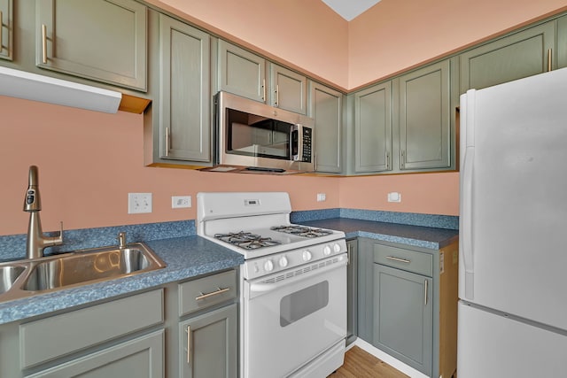 1423 Red Top Ln, Minooka, IL 60447 - kitchen featuring white appliances, dark countertops, and light wood-style flooring