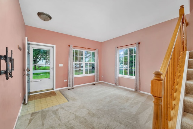 1423 Red Top Ln, Minooka, IL 60447 - carpeted foyer entrance featuring baseboards and stairway