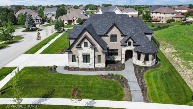 20145 Waterview Trl, Frankfort, IL 60423 - french country home featuring stone siding, roof with shingles, a residential view, and a front lawn
