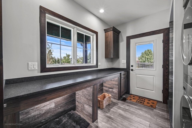 20145 Waterview Trl, Frankfort, IL 60423 - washroom featuring stacked washer / dryer, cabinet space, wood finished floors, and recessed lighting