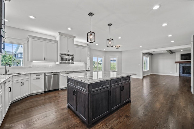 20145 Waterview Trl, Frankfort, IL 60423 - kitchen featuring dishwasher, white cabinetry, recessed lighting, open floor plan, and backsplash