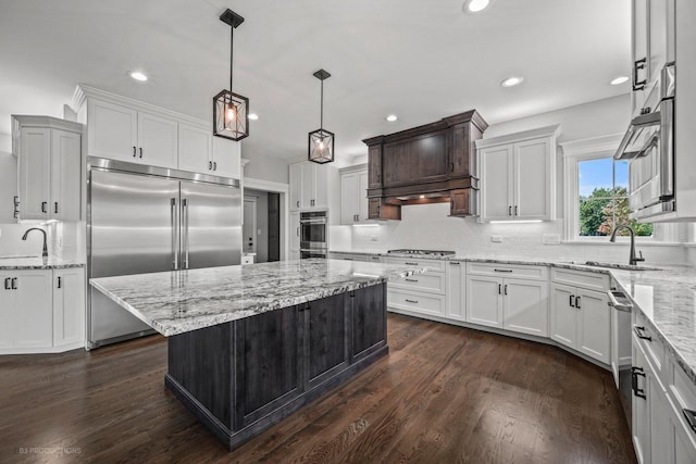 20145 Waterview Trl, Frankfort, IL 60423 - kitchen featuring appliances with stainless steel finishes, decorative backsplash, white cabinetry, dark wood finished floors, and recessed lighting