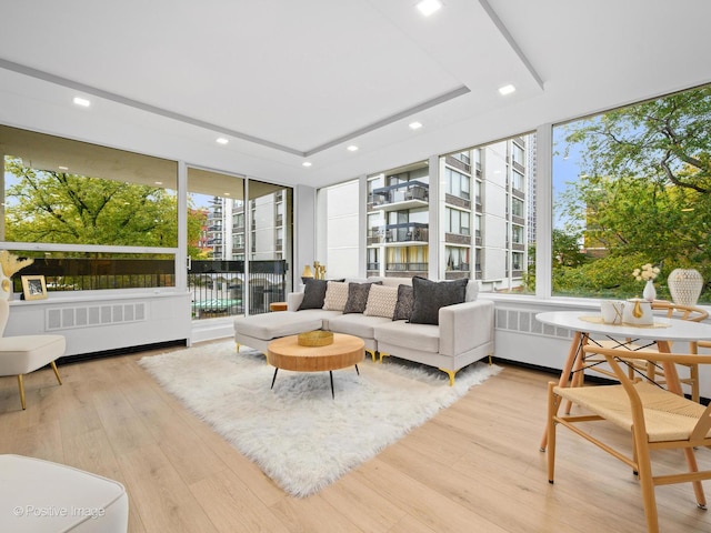1455 N Sandburg Ter Unit 209B, Chicago, IL 60610 - living area featuring recessed lighting, wood finished floors, floor to ceiling windows, and a tray ceiling
