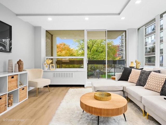 1455 N Sandburg Ter Unit 209B, Chicago, IL 60610 - living room with wood finished floors, recessed lighting, and expansive windows