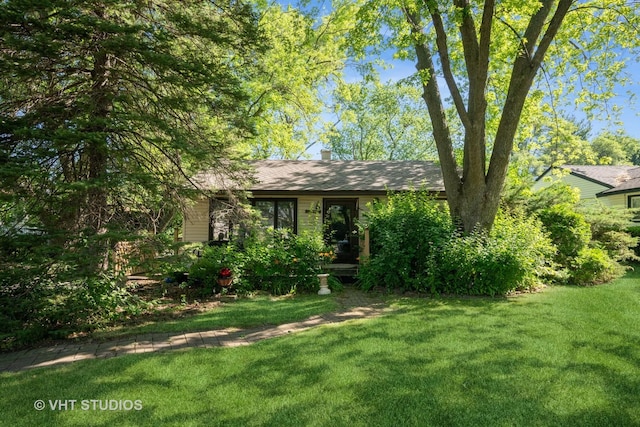 2506 Sigwalt St, Rolling Meadows, IL 60008 - view of front facade with a front yard and a chimney
