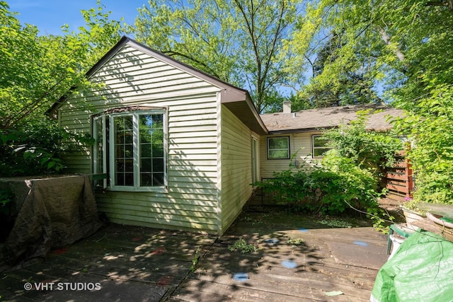 2506 Sigwalt St, Rolling Meadows, IL 60008 - view of property exterior with a wooden deck and a chimney
