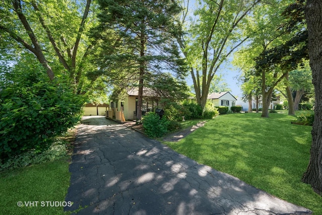 2506 Sigwalt St, Rolling Meadows, IL 60008 - view of front of property with a front yard, driveway, and a garage
