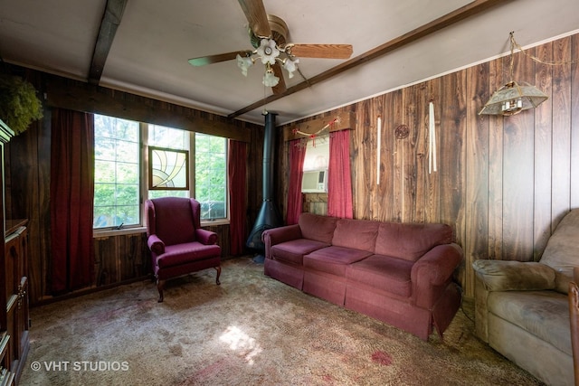 2506 Sigwalt St, Rolling Meadows, IL 60008 - carpeted living room with wooden walls, ceiling fan, a wood stove, and cooling unit