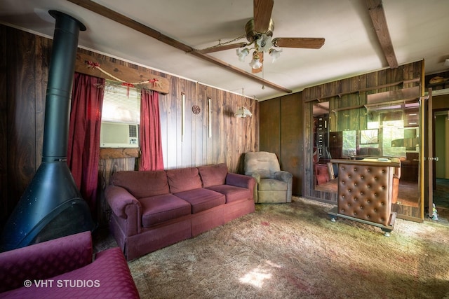 2506 Sigwalt St, Rolling Meadows, IL 60008 - carpeted living area with a ceiling fan, a wood stove, wood walls, and cooling unit
