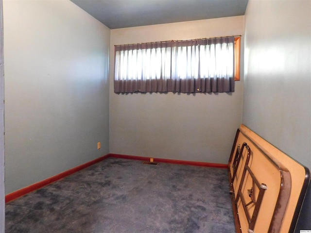 3411 Payson Rd, Quincy, IL 62305 - carpeted empty room featuring baseboards