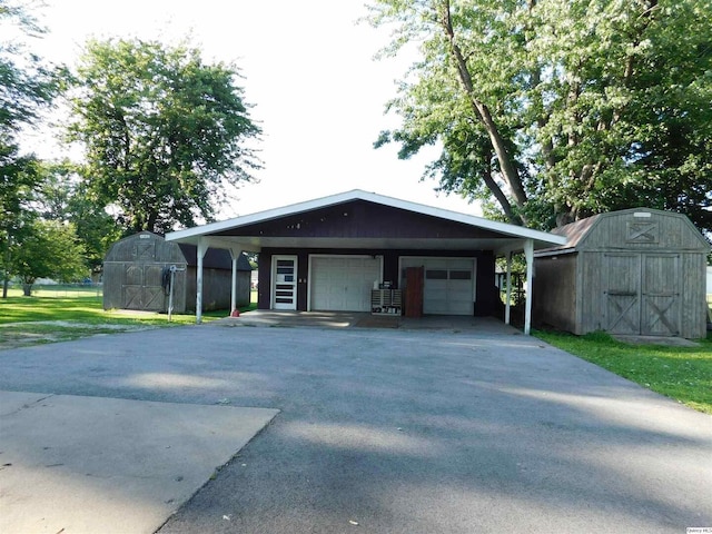 3411 Payson Rd, Quincy, IL 62305 - view of front of home with a storage shed and a garage