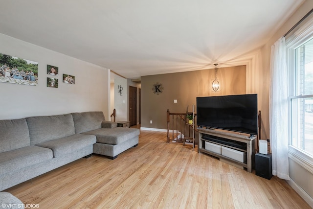 303 W 8th Pl, Hobart, IN 46342 - living room featuring light wood-style floors and plenty of natural light