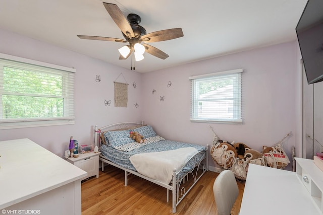 303 W 8th Pl, Hobart, IN 46342 - bedroom featuring light wood-type flooring and a ceiling fan