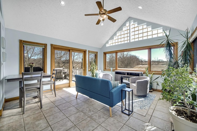 328 Windermere Dr, Chesterton, IN 46304 - living room with a textured ceiling, light tile patterned floors, ceiling fan, high vaulted ceiling, and recessed lighting