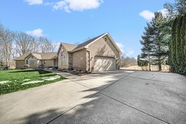 328 Windermere Dr, Chesterton, IN 46304 - view of front facade featuring concrete driveway, brick siding, a garage, a front lawn, and a shingled roof