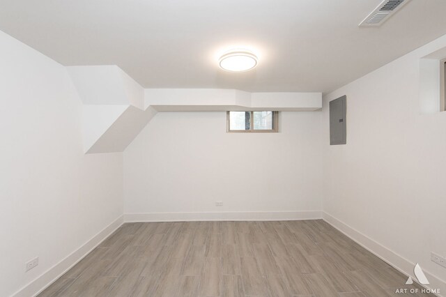 9156 S Sawyer Ave, Evergreen Park, IL 60805 - bonus room featuring electric panel and light wood finished floors