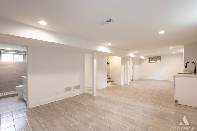 9156 S Sawyer Ave, Evergreen Park, IL 60805 - below grade area with stairway, recessed lighting, and light wood finished floors