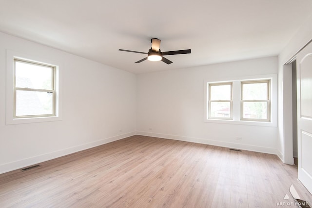 9156 S Sawyer Ave, Evergreen Park, IL 60805 - unfurnished bedroom featuring light wood-style flooring, a closet, and ceiling fan