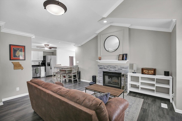 1901 Sumac Dr, Champaign, IL 61821 - living room featuring crown molding, dark wood-style floors, ceiling fan, lofted ceiling, and a stone fireplace