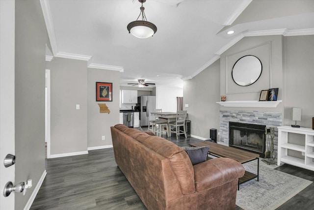 1901 Sumac Dr, Champaign, IL 61821 - living room with ceiling fan, dark wood-style flooring, crown molding, a stone fireplace, and lofted ceiling