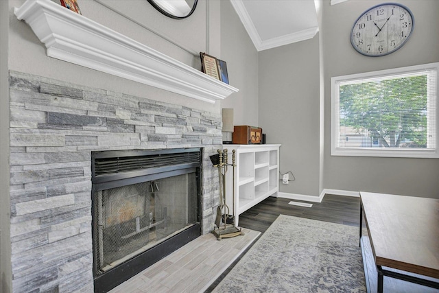 1901 Sumac Dr, Champaign, IL 61821 - detailed view of ornamental molding, a stone fireplace, and wood finished floors