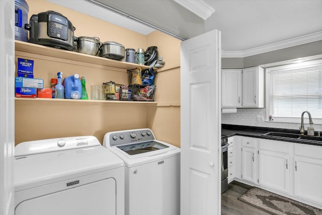 1901 Sumac Dr, Champaign, IL 61821 - washroom with washing machine and clothes dryer, crown molding, and dark wood-style floors