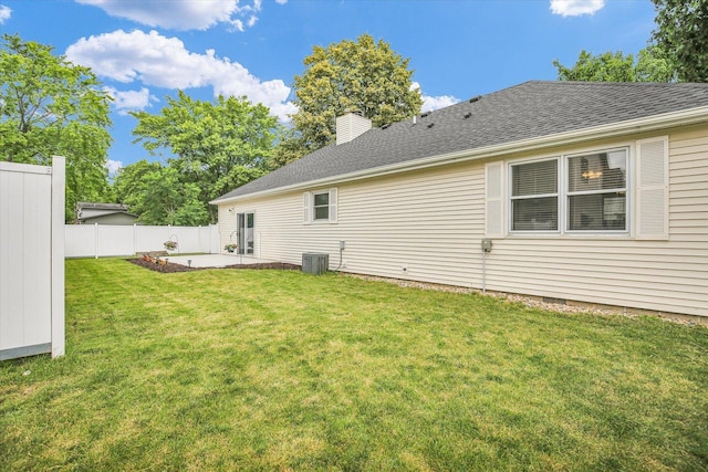 1901 Sumac Dr, Champaign, IL 61821 - back of house featuring a patio, a chimney, and a shingled roof